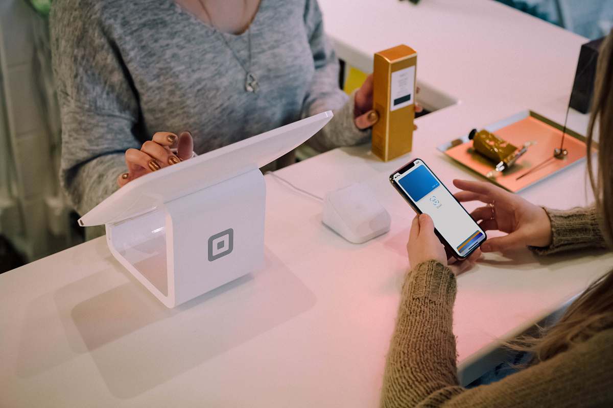 electronics person browsing on white monitor phone
